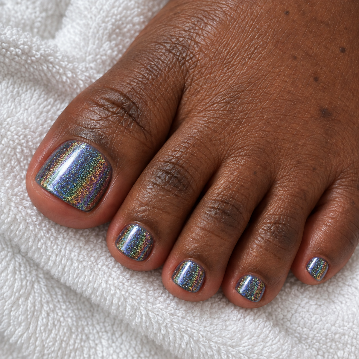 Sleek holographic nail powder pedicure